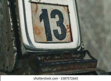 Day 13 Number On Metal Rusty Vintage Calendar. Bad Day Concept.