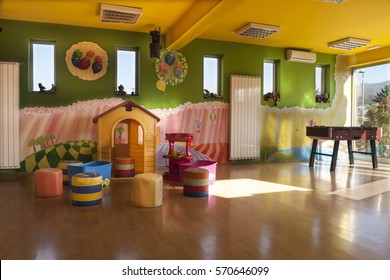 A Day Care Center For Children With Mottled Walls And Lots Of Toys