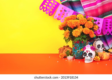 Day Of The Dead, Dia De Los Muertos Celebration Background With Sugar Skull, Calaverita, Marigolds Or Cempasuchil Flowers, Bread Of Death Or Pan De Muerto With Copy Space. Traditional Mexican Culture 