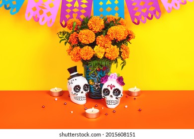 Day Of The Dead, Dia De Los Muertos Celebration Background With Sugar Skull, Calaverita, Marigolds Or Cempasuchil Flowers And Candles With Copy Space. Traditional Mexican Culture 