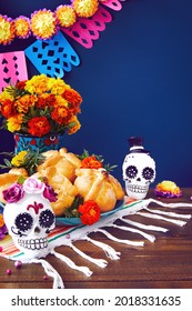 Day Of The Dead, Dia De Los Muertos Celebration Background With Sugar Skull, Calaverita, Marigolds Or Cempasuchil Flowers, Bread Of Death Or Pan De Muerto With Copy Space. Traditional Mexican Culture 