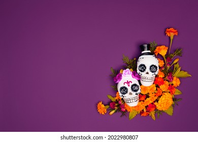 Day Of The Dead, Dia De Los Muertos, Halloween Celebration Background. Sugar Skull, Calaverita, Marigolds Flowers, Purple Copy Space. Traditional Mexican Culture Festival Flyer. Flat Lay, Top View.