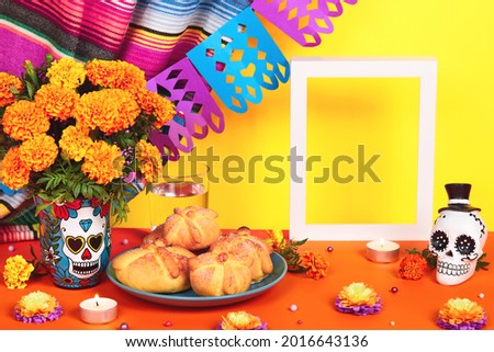 Day of the dead, Dia De Los Muertos Celebration Background With sugar Skull, calaverita, marigolds or cempasuchil flowers, bread of death or Pan de Muerto and empty frame. Traditional Mexican culture 