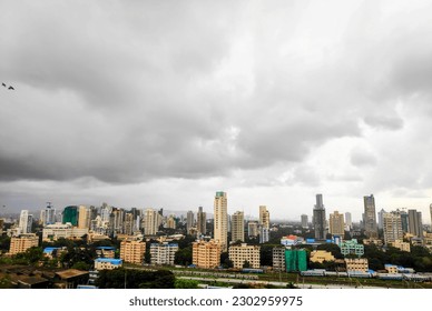 A day full of dark clouds in the sky in the City of Mumbai on a rainy monsoon day in the city of Mumbai, India - Shutterstock ID 2302959975