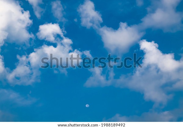 day moon in the sky\
with beautiful cloud
