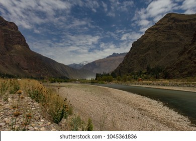 Day for night long exposure along the Urubamba river in the Sacred Valley near Lamay Peru with the Andes mountains in the background.