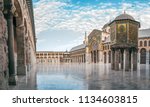 day panoramic view of the umayyad mosque under the blue sky and white clouds. showing the islamic architecture and islamic art in this holy place in damascus syria.