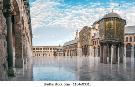 day panoramic view of the umayyad mosque under the blue sky and white clouds. showing the islamic architecture and islamic art in this holy place in damascus syria.