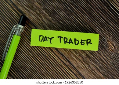 Day Trader Write On Sticky Notes Isolated On Wooden Table.