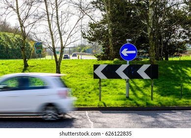 Day View Of Busy Traffic On UK Motorway Roundabout