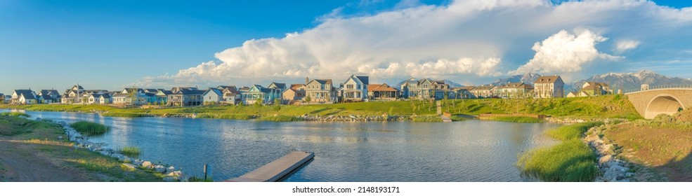 Daybreak residential community near the bridge over the Oquirrh lake with dock at the front