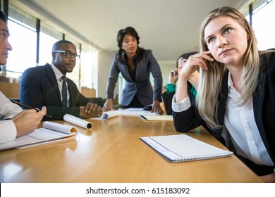 Daydreaming Business Woman At Company Meeting Bored Disinterested Not Paying Attention