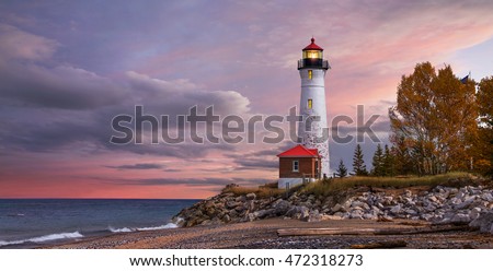 As daylight begins yielding to twilight, The Crisp Point Lighthouse at sunset on Lake Superior, Upper Peninsula, Michigan, USA - A one hour drive from Tahquamenon Falls, mostly dirt roads