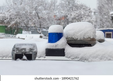 Daylight. Police Siren Blue Under The Snow. Close-up