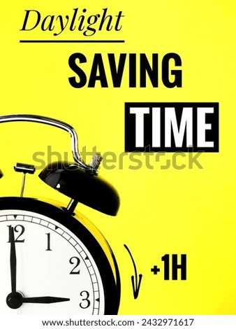 Daylight Saving Time Transition: Alarm Clock at 2 o'clock Switching to Daylight Hour on a yellow background 