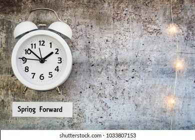 Daylight Savings Time Spring Concept Top Down View With White Clock And String Lights