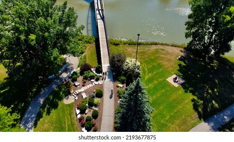 Daytime Ariel Picture Of People Walking Around The Tridge, Enjoying The Sunshine