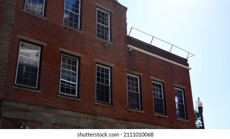 Daytime Establishing Shot Of Old Brick Apartment Building In City