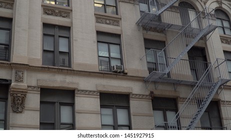 Daytime Exterior Establishing Shot Outside A Typical Generic Urban City Style Apartment Building. Setting For College Dorm Loft Flat Rented Home. Matching Night Shot Available