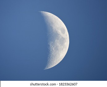 Daytime Moon 39%, Waxing crescent : taken with an 8" Newtonian telescope and a Canon dslr. The Moon in daytime in a blue sky has something beautiful.