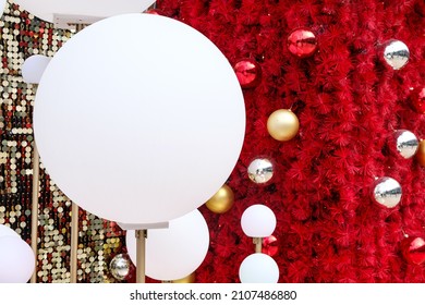 Daytime Outdoor Christmas Decoration With White Big And Small Round Balls On Red And Gold Background