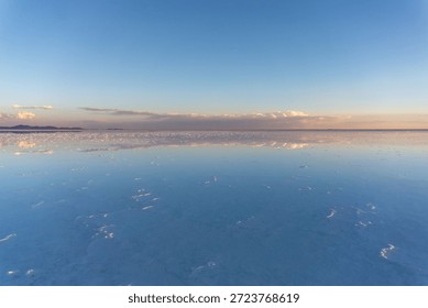 Daytime reflection of clouds at Salar de Uyuni salt flats in Bolivia