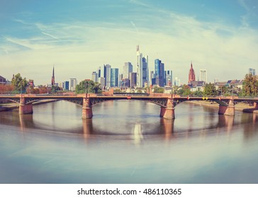 Daytime view of Frankfurt city skyline with Alte Brucke bridge. Creative wide angle effect
