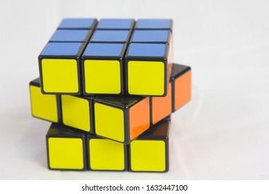 Dayton, OH- Jan 28, 2020: Rubix Cube Sitting On White Sheet. White Background Of Popular Toy