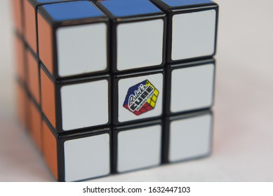 Dayton, OH- Jan 28, 2020: Rubix Cube Sitting On White Sheet. White Background Of Popular Toy