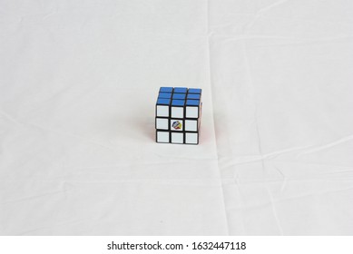 Dayton, OH- Jan 28, 2020: Rubix Cube Sitting On White Sheet. White Background Of Popular Toy