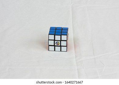 Dayton, OH- Jan 28, 2020: Rubix Cube Sitting On White Sheet. White Background Of Popular Toy