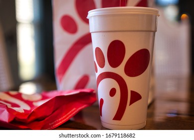 Dayton, OH- Mar 16, 2020; Chick Fil A Food Items On Wooden Table With Blurred Background