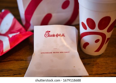 Dayton, OH- Mar 16, 2020; Chick Fil A Food Item Flat Lay On Wooden Table