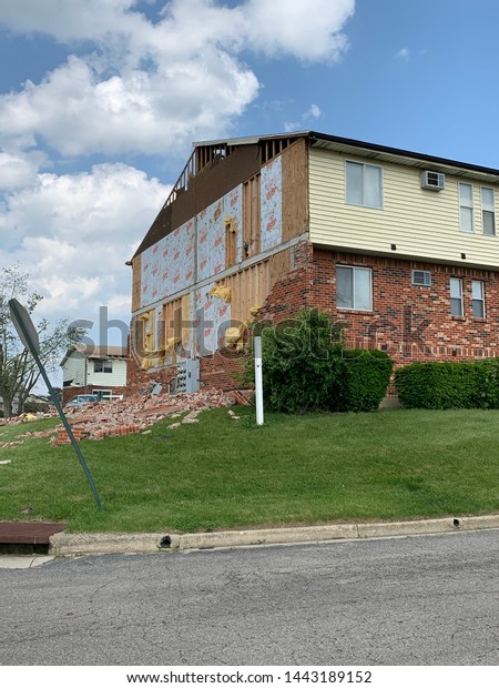 Dayton, OH- May 27, 2019: Aftermath of Memorial Day\
Tornados in Beavercreek. Damage includes uprooted trees, down\
signs, broken down walls, building destroyed. Widespread damage.\
straight line winds