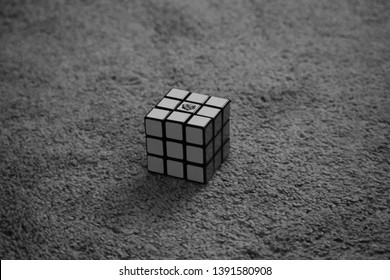 Dayton, OH- May 7, 2019: Solved Rubix Cube Isolated Sitting On A Tan Carpeted Floor