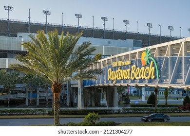 Daytona Beach, FL - February 2, 2022: Daytona Beach Sign And Palm Tree Near The Daytona International Speedway NASCAR Racetrack