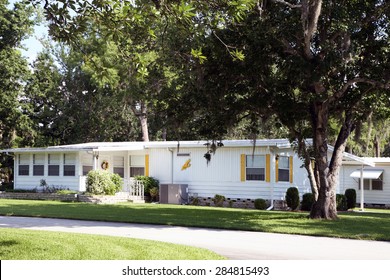 DAYTONA BEACH, FL-MAY, 2015:  Older mobile home in a retirement community is well cared for with nice landscape and awnings.  