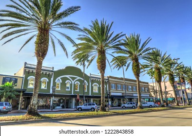 Daytona Beach Florida Downtown Business District And Row Of Evenly Spaced Palm Trees In The Center Median