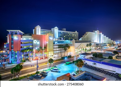 DAYTONA BEACH, FLORIDA - JANUARY 3, 2015: Hotels Line Downtown Daytona Beach At Night. The City Is A Popular Beachfront Destination.