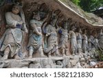 The Dazu Rock Carvings are a series of Chinese religious sculptures and carvings located in Dazu District, Chongqing, China. The carvings date back as far as the 7th century AD, depicting and influenc