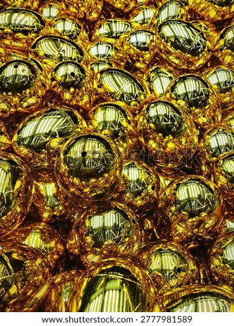 A dazzling array of shiny gold capsules reflects the rhythmic light of the ceiling lights, creating a surreal metallic tapestry of distorted luminosity. Gold gradient abstract background. Vending machine