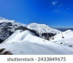 Dazzling white snow covered mountains at The Himalayas, India