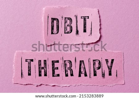DBT therapy written on paper notes. Dialectical Behavior Therapy psychological treatment concept.