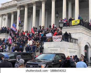 “Washington, DC - January, 6 2021: Trump supporters rioting at the US Capitol.”