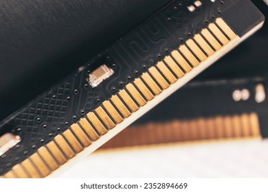 DDR4 DRAM memory module golden electrical contact macro. Computer RAM chipset hardware close-up. Desktop PC memory parts for assemble