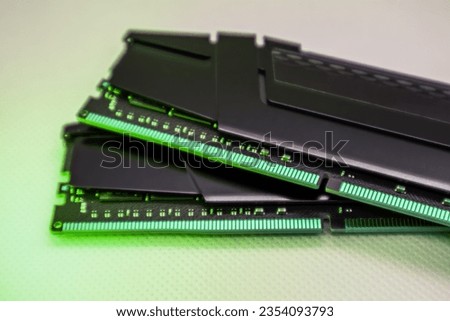 DDR4 DRAM memory modules. Computer RAM chip close-up on white in green light. Desktop PC memory parts for assemble