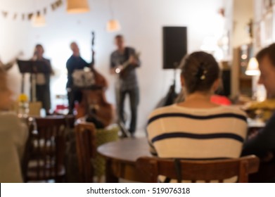 De Focused Photo Of Concert Band Playing In Country Style Music In Cozy Cafe.