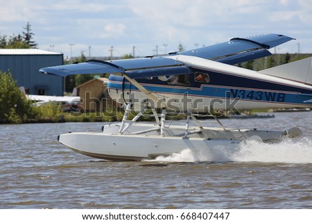 De Havilland Beaver floatplane takes off from Lake Hood seaplane base, Anchorage, Alaska