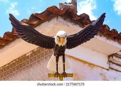 São José de Ribamar, Maranhão, Brazil, July 2022. The sculpture of an eagle with open wings, in a corner of the square of the church of São José de Ribamar.