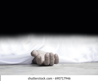 Dead Body Laying On A Floor.Focus At The Hand